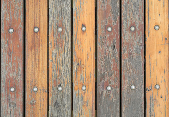 Fototapeta premium natural wooden plank fence texture with nuts