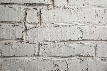 very old brick wall. plaster is applied many time