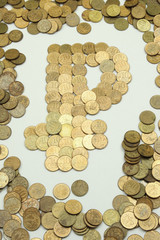 Russian Ruble. The sign of the Russian ruble is made of small metal coins-kopecks