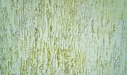 Abstract textured background: mixture of blue and green putty. Uneven strokes, rough texture of a wall pattern