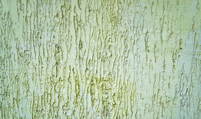 Abstract textured background: mixture of blue and green putty. Uneven strokes, rough texture of a wall pattern