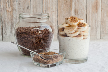 Kefir in a glass with milled flax seeds and banana