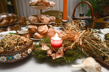 Traditional Christmas table in Ukraine, twelve meatless dishes, burning candle. family dinner. selective focus