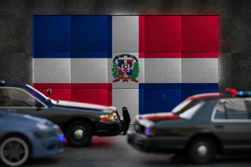 Bright digital display Dominican Republic flag in city as cars drive past