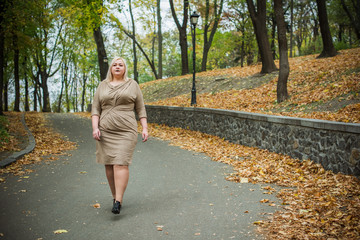 Plus size model concept. Large size lady walk outdoor, big woman at city. Fashionable lifestyle and lifestyle xl women. Big and pretty girl 