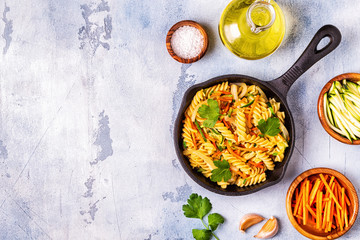 Fusilli pasta with squid, zucchini and carrots