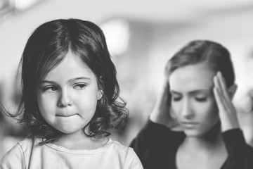 Fototapeta premium Sad Mother and daughter at home