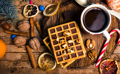 New Year and Christmas treats and sweets. Waffles and cookies with decorations