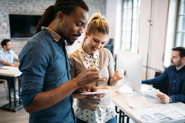 Portrait of architects having discussion in office