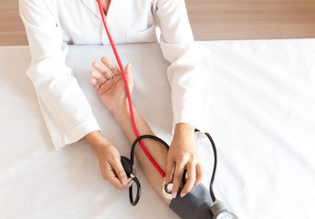 Female doctor measuring blood pressure, Healthy concept
