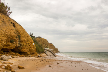 stormy cliffs on the Atlantic coast in Andalusia at high tide
