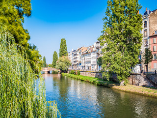 Fototapeta premium Strasbourg, France - Aug 18, 2018: view of historic district in old town, nestles on an island formed by two arms of the River Ill. It is home to an impressive historic and architectural heritage