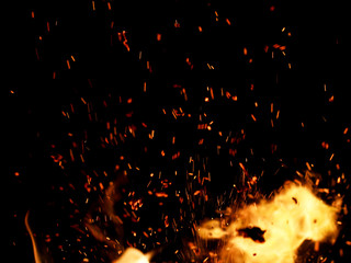 flame of fire with sparks on a black background