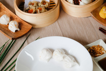 Fototapeta na wymiar Set of Dim sum Enjoying traditional Chinese dumpling.