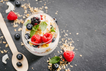 Yogurt with fresh berries served in glass