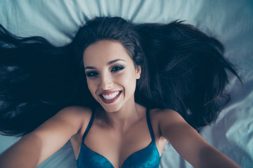 High above angle top view of careless carefree nude doll in blue