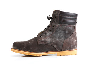 Brown boot filled with white fungus isolated on a white background.side view