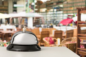 Vintage hotel reception service desk bell on