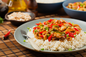 Chicken kung pao. Fried chicken pieces with peanuts and peppers.