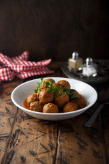 Meatballs with tomato sauce and parsley