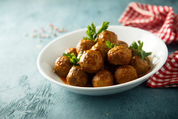Meatballs with tomato sauce and parsley