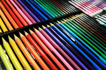 Color pencils pattern sort in box set colorful background.