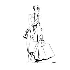 Young woman in her 30s on a fashion haul, carrying many shopping bags