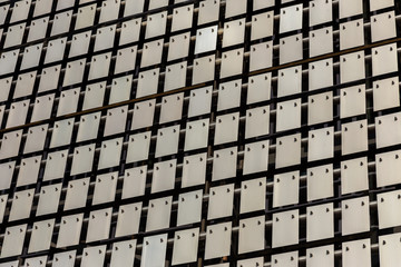 The kinetic facade of the building. Stainless steel metal plates hang freely and sway in the wind....