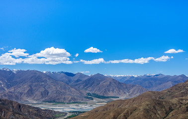 Desert and mountain over blue sky and white clouds on altiplano