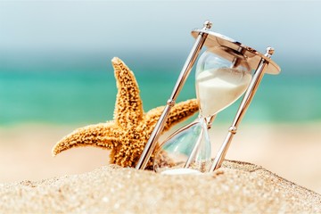Sand running through the bulbs of an