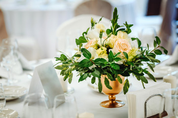 Wedding table set up. Indoor set up of a wedding/party table with  flower decoration