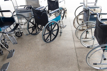 Fototapeta na wymiar Empty wheelchair in hospital. Medical equipment in hospital for patient.