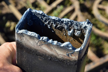 metal structures after gas cutting. melted metal on rusty profile pipes. close-up detail