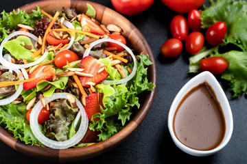 High angle of colorful vegetable salad in wood bowl