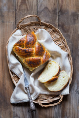traditional Jewish challah bread on wooden background from boards