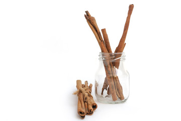 Cinnamon in a glass on a white background,isolated cinnamon