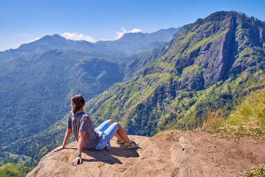 girl enjoys life at the top of the mountain in Ella, Sri Lanka