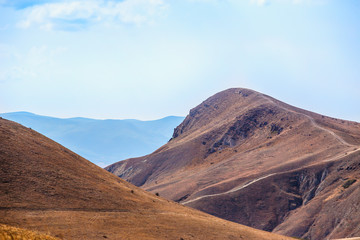 mountain landscape with blue cloudy sky