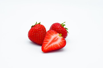 Strawberries cut isolated on white background, piece of strawberry