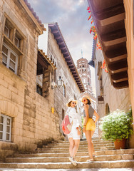Hipster girls friends travels in Europe city at summer vacation © EdNurg