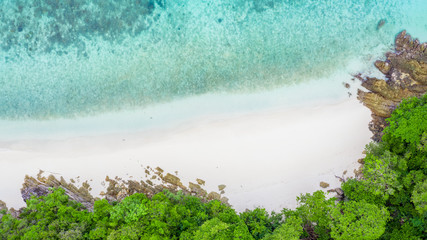 Aerial top view beautiful tropical island with white sand beach and blue clear water, Top view above coral reef, Andaman sea, Myanmar.