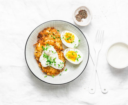 Potato Latkes And Boiled Egg - Healthy Breakfast Or Snack On Light Background, Top View