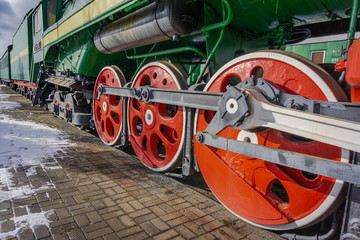 The huge wheels of the locomotive train