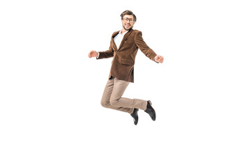 Fototapeta na wymiar happy male model in eyeglasses and velvet jacket jumping isolated on white