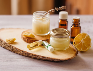 Hand cream and lip balm in a glass jar. Natural organic cosmetics with honey, wax and oils.