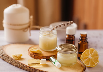 Hand cream and lip balm in a glass jar. Natural organic cosmetics with honey, wax and oils.