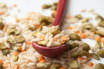 closeup of rice, split peas and  lentils on white background
