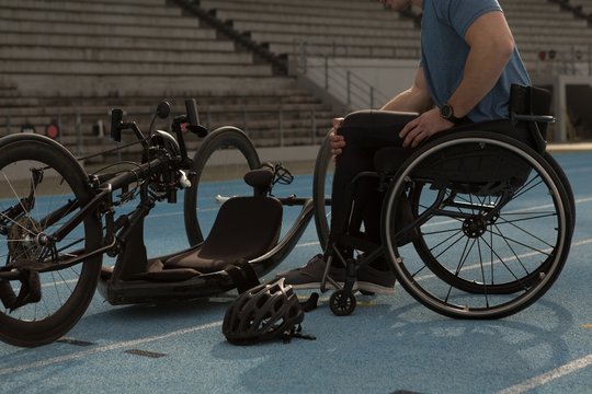 Disabled athlete with wheelchair on racing running track