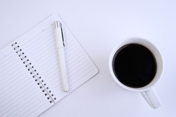 Office stationery on white on table top.