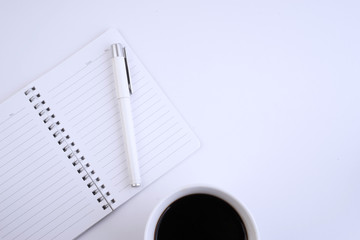 Office stationery on white on table top.